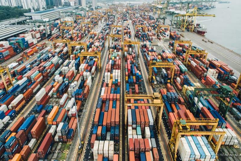 Container vessel berthed at Tema Port with cargo handling equipment